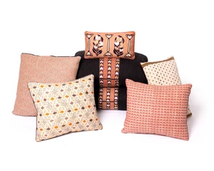 A group of seven cushions by Robert Kime Ltd., comprising: A pair of modern black cotton embroidered cushions, with a central striped design, 35 x 54cm; a Dong