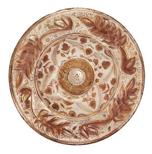 
	
		A copper lustre-painted Hispano-Moresque pottery charger, Spain, 18th century, of shallow...