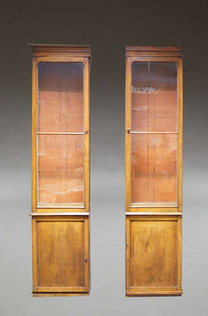 
	
		Two Victorian mahogany narrow bookcases, formerly sections of a larger bookcase, the...