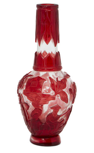  A Chinese Peking red-overlay glass bottle vase, early 20th century, carved with figures in a...