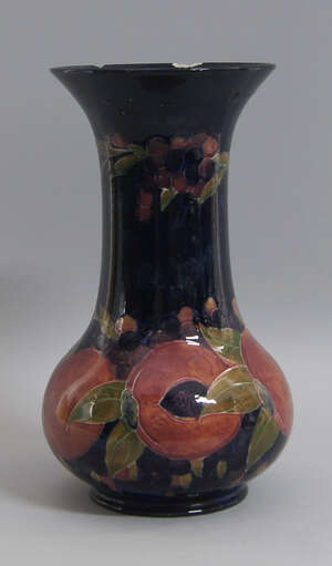 A large Moorcroft pomegranate pattern vase, impressed and signed marks to base, (a/f)33cm high
		 
		 