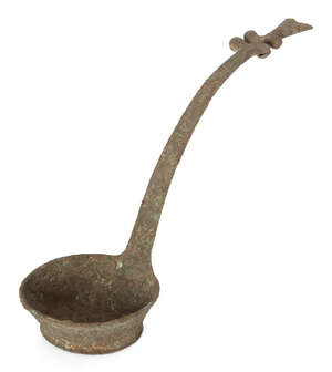 A Vietnamese bronze ritual ladle, Dong Son culture, ca. 2500BCE, the long tapering shaft cast...