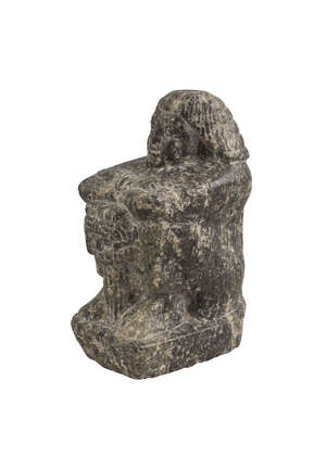 
	
		An Egyptian Diorite seated figure, Predynastic period, circa 3200BC., shown with knees...