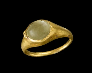 An Islamic medieval gold ring with inset now lacking,Near East, circa 12th century
The band...