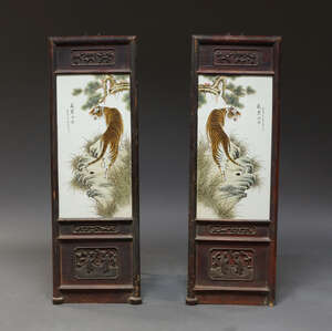 
	
		A pair of Chinese porcelain plaques decorated with tigers, late 20th century, within rock...