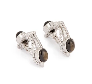 A pair of 18ct white gold black star sapphire stirrup cufflinks, each set with two black star...
