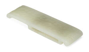 
	
		A Chinese white jade archaistic belt mount, 18th/19th century, carved to the upper...