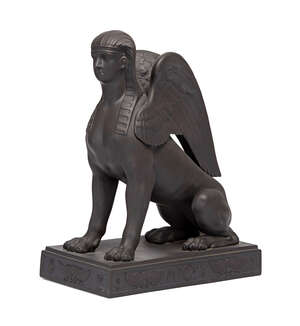 
	
		A Wedgwood black basalt model of a sphinx, late 20th century, seated on a rectangular...