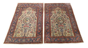 A pair of Persian Sarouk rugs, third quarter 20th century, the central field with vase of...