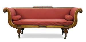 
	
		A Regency mahogany sofa, the top rail with raised gadrooning, having carved scrolling...