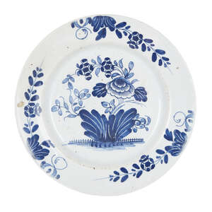 
	
		An English delft blue and white plate, probably Liverpool, mid-18th century, decorated...