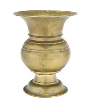 
	
		A brass vase, India, 18th century, of baluster form, on a domed foot, with wide flaring...
