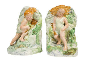 
	
		Bretby Art Pottery, a pair of glazed earthenware bookends 
		c.1930, impressed Pottery...