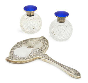 An American Sterling silver Art Nouveau hand mirror, c.1900. Theodore W. Foster & Bro. (successor to Foster & Bailey 1878-1898), with sinuous scrolling floral 