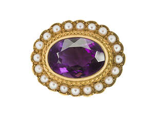 
	
		An Edwardian gold and half-pearl brooch, the collet-set oval mixed-cut amethyst in gold...
