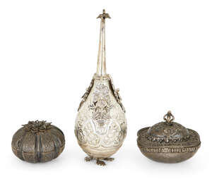 
	
		A white metal rosewater sprinkler and two silver boxes, 19th-early 20th century, the...