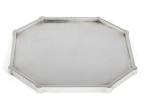 An octagonal Britannia silver covered presentation tray, London, c.1929, British Metallising Co Ltd., with shaped sides and base patterned with engine-turned s