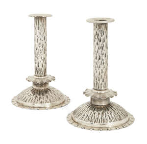 
	
		A pair of Heath & Middleton silver candlesticks in the manner of Dr Christopher Dresser ...