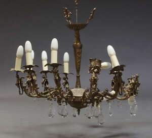 
	
		A Continental brass twelve-light chandelier, late 20th century, the scroll branches...