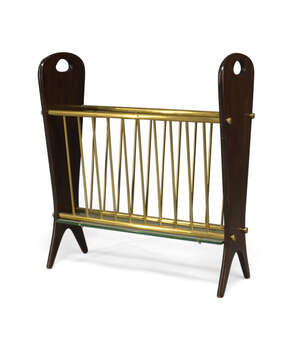 
	
		Italian, a stained beech, brass and glass magazine rack  
		c.1950  
		With shaped...
