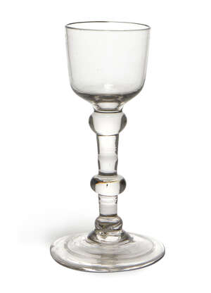 
	
		A George II cordial glass, c.1730, with bucket form bowl, to double knopped stem, with...