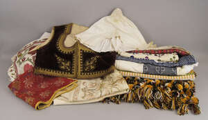 
	
		A Turkish velvet waist coat, late 19th century, with gilt brocade decoration to the...
