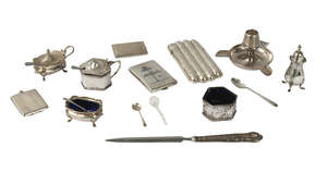 A silver combination ashtray, striker and match holder, Birmingham c.1913, William Devenport, together with a three piece cruet set, two further cruets, an Egy
