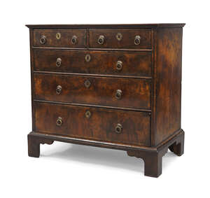 
	
		A George I walnut chest of drawers, circa 1720, mahogany crossbanded, with two short...