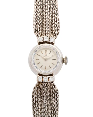Omega. An 18ct white gold diamond set manual wind cocktail watchLondon hallmark for 196117-jewel calibre 483 manual wind movement, silvered dial with applied b