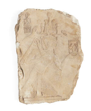 
	
		An Egyptian style limestone relief fragment of a kneeling pharaoh wearing a kilt, and an...