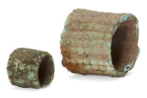 A Chinese bronze bracelet and ring, each with studded decoration, 4.5cm and 2.5cm diameter (2)
