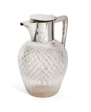 
	
		A silver mounted cut crystal claret jug, London, 1898, Maxfield & Sons, the oval body cut...