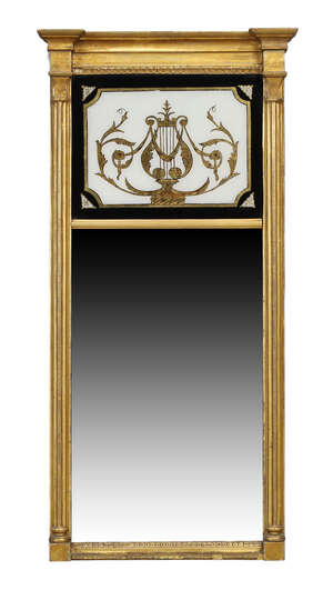 A Regency giltwood pier glass, c.1820, with mounlded cornice above verre eglomise panel...