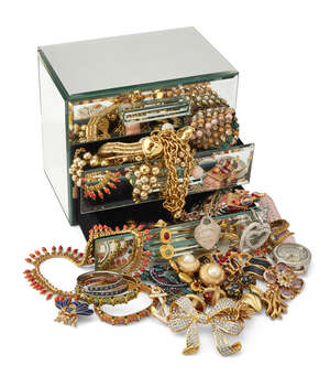 
	
		A quantity of costume jewellery, including: a Tiffany chain link bracelet; two green cord...