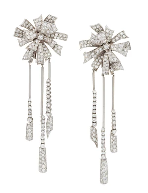 A pair of diamond set drop earrings, in the form of stylised rosettes, the brilliant-cut diamond...