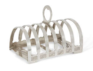 
	
		Liberty & Co, a seven-bar toast rack 
		Mark of Liberty & Co., Birmingham, 1933, stamped...