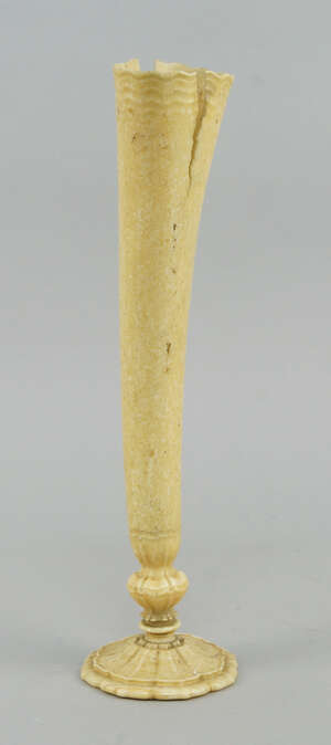 
	
		A Continental marine ivory vase, 19th century, possibly walrus tusk, the curving body...
