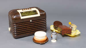 
	
		A Bush brown bakelite cased radio, together with further items of Art Deco bakelite and...