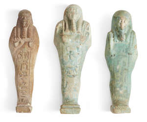 
	
		Three Egyptian glazed faience shabtis 
		Late Dynastic Period, circa 664-332 B.C.
		