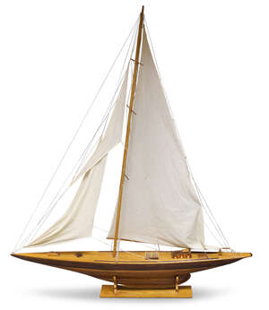 
	
		A large wooden model of a J class yacht, late 20th century, with linen sails and rigging,...