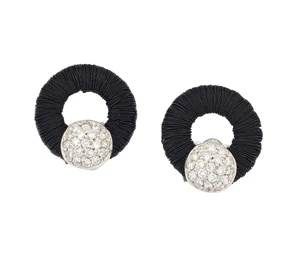 A pair of diamond earstuds, composed of a circular wire wrapped frame, with brilliant-cut...