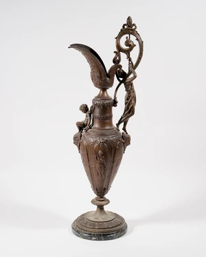 A large spelter ewer with figural decoration, 20th century, decorated with a figure of lady with...