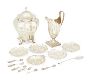 A Victorian silver tea caddy, Chester, c.1896, George Nathan & Ridley Hayes, of octofoil form, with hinged lid, together with a cream jug raised on a square fo