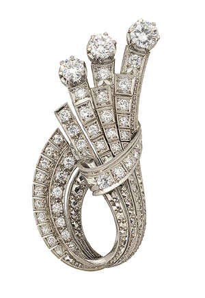 
	
		A diamond spray brooch, of stylised folded ribbon design square-set with circular-cut...
