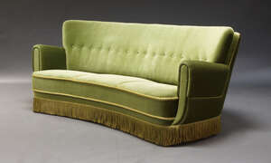 
	
		An Italian button back sofa, second half 20th Century, of curved form, upholstered in...