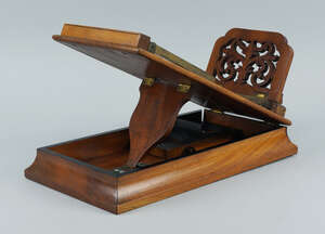 
	
		A walnut stereoscope viewer, late 19th/early 20th century, the top with a pierced sliding...