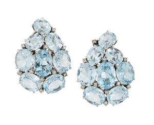 A pair of blue topaz and diamond ear clips,  each designed as an oval mixed-cut pale blue topaz pear-shaped cluster with circular-cut diamond points, 4cm long