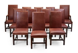 A set of twelve modern mahogany dining chairs, of George III style, with burgundy faux leather...