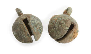
	
		Two Chinese bronze animal bells, Neolithic period, each of spherical form with loop...