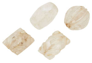 
	
		Four carved rock crystal beads, India or Iran, 17th century and earlier, one of round...